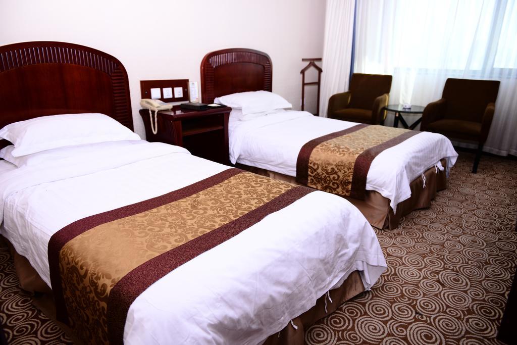Heilongjiang Kunlun Hotel Harbin Room photo